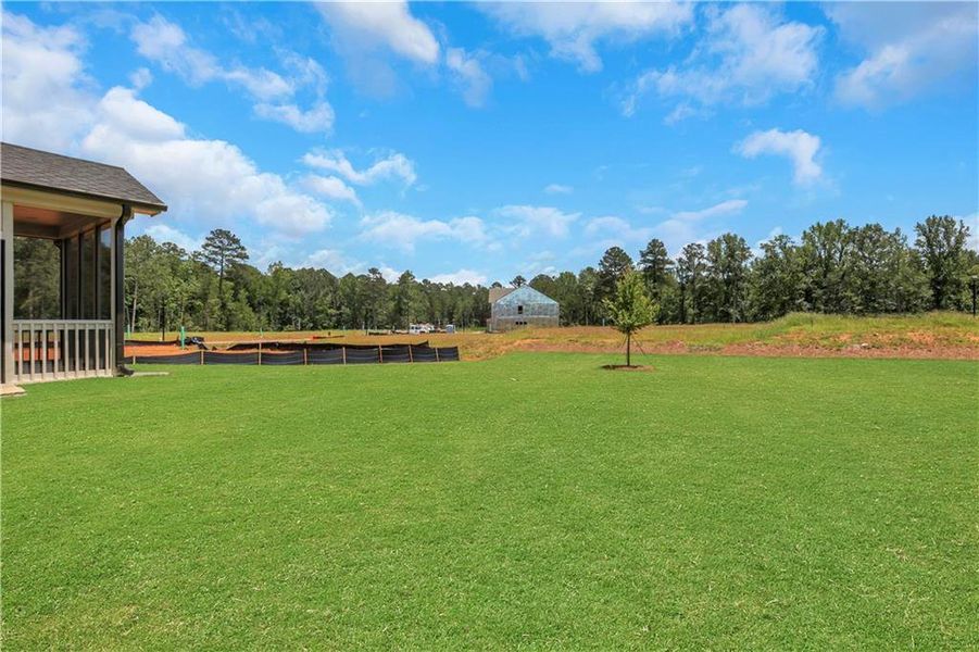 Front exterior of a new home in Twin Lakes, Hoschton, GA, highlighting curb appeal (Image 24). Front exterior of a new home in Twin Lakes, Hoschton, GA, highlighting curb appeal (Image 24).