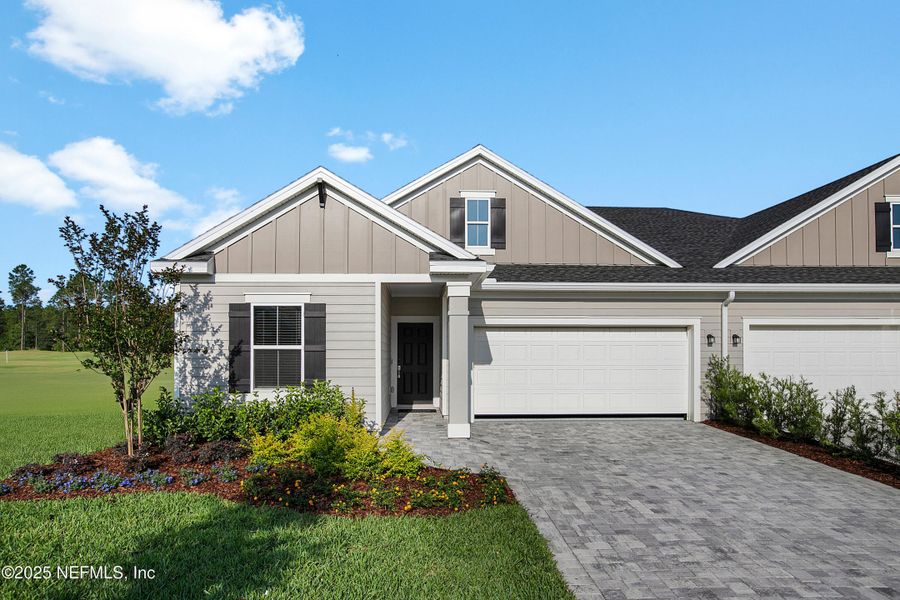 Front exterior of a new home in Stillwater | Active Adult 55+: Stillwater - Villas, St. Johns, FL, highlighting curb appeal (Image 2).