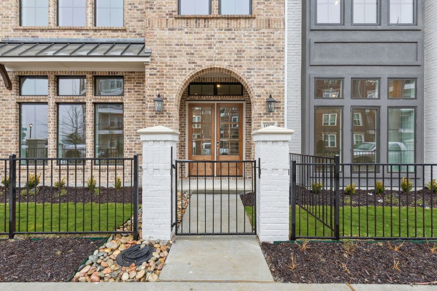Exterior details and patio area of a home in Newman Village Townhomes, Frisco (Image 19).