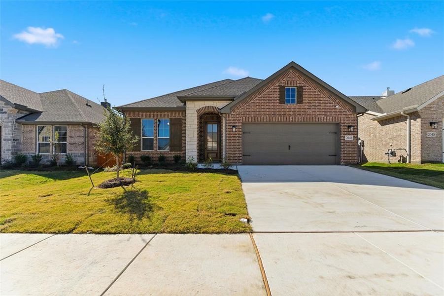 Front exterior of a new home in Northstar, Haslet, TX, highlighting curb appeal (Image 1).