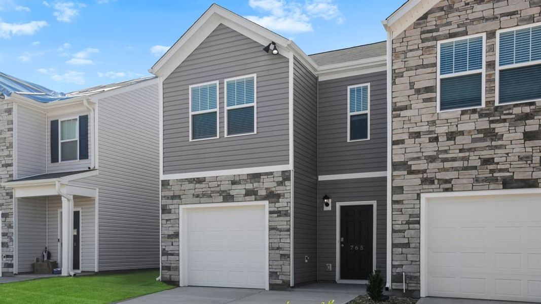 Front exterior of a new home in Covington Village, Greer, SC, highlighting curb appeal (Image 2). Front exterior of a new home in Covington Village, Greer, SC, highlighting curb appeal (Image 2).