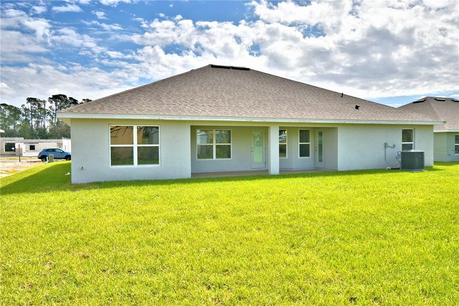 Exterior details and patio area of a home in Cadence Crossing, Auburndale (Image 2).