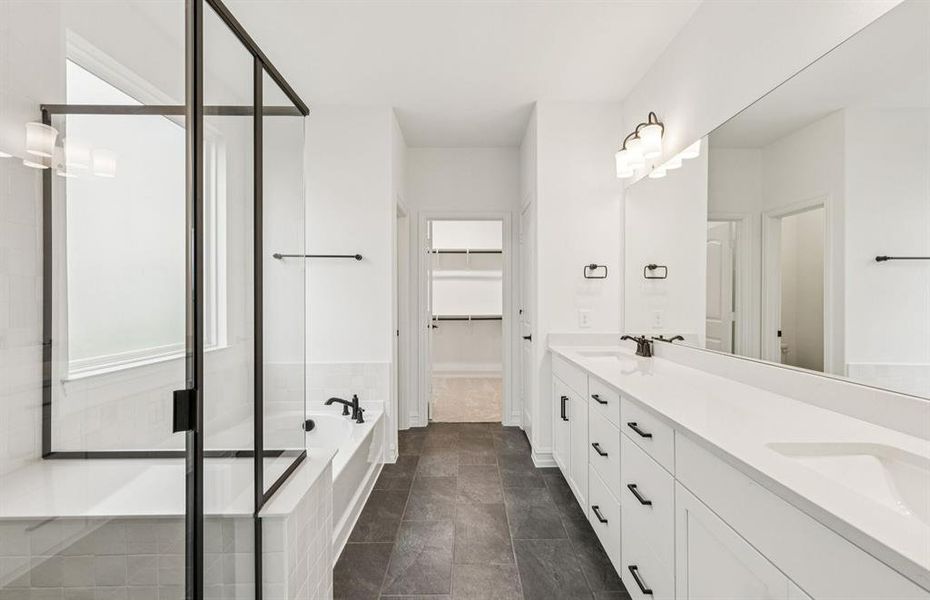 Owner's suite bath with a luxurious deep walk-in shower  *Real home pictured