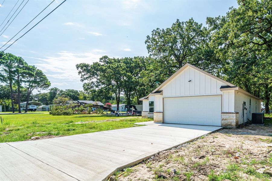 Garage featuring driveway Garage featuring driveway