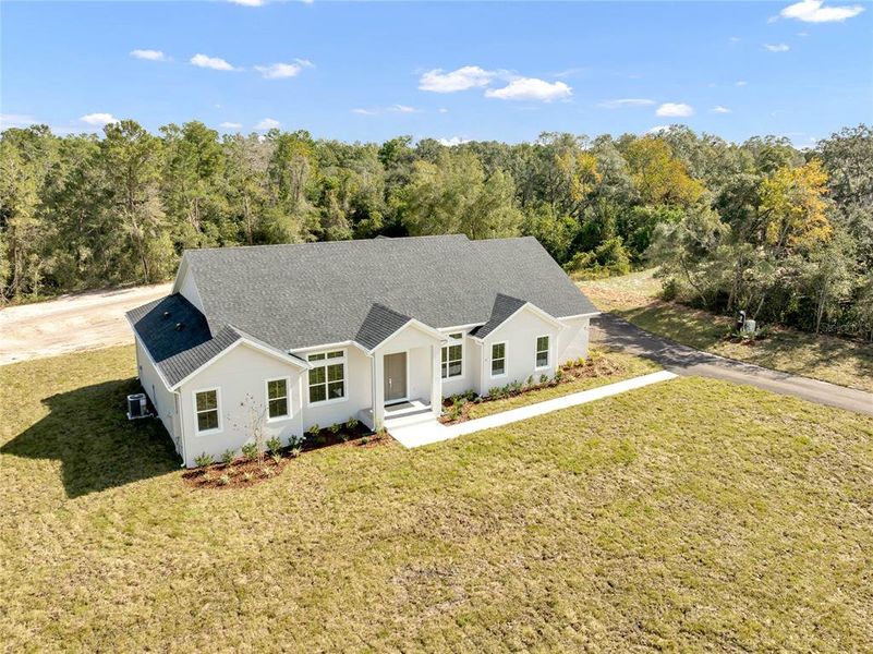 Front exterior of a new home in , Debary, FL, highlighting curb appeal (Image 30). Front exterior of a new home in , Debary, FL, highlighting curb appeal (Image 30).