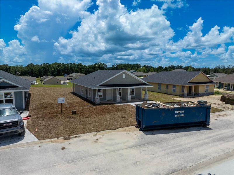 Front exterior of a new home in Rolling Hills, Bell, FL, highlighting curb appeal (Image 14).