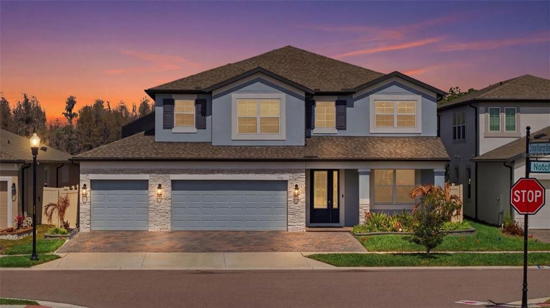 Front exterior of a new home in Whispering Oaks Preserve, Wesley Chapel, FL, highlighting curb appeal (Image 28). Front exterior of a new home in Whispering Oaks Preserve, Wesley Chapel, FL, highlighting curb appeal (Image 28).