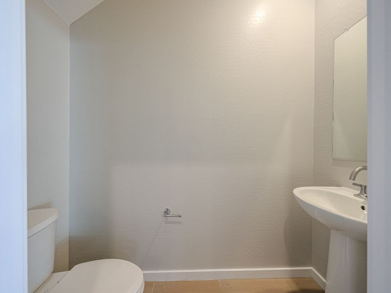 A bathroom with a sink and toilet. A bathroom with a sink and toilet.