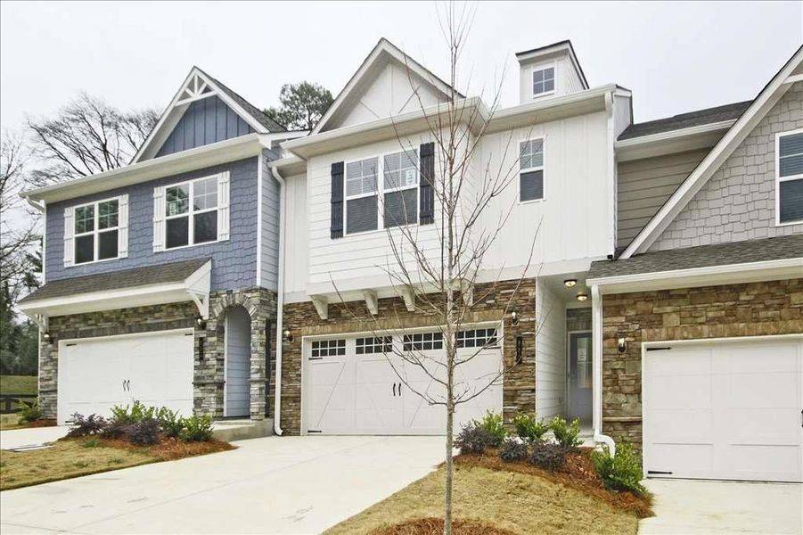 Front exterior of a new home in Porter Reserve, Decatur, GA, highlighting curb appeal (Image 2). Front exterior of a new home in Porter Reserve, Decatur, GA, highlighting curb appeal (Image 2).
