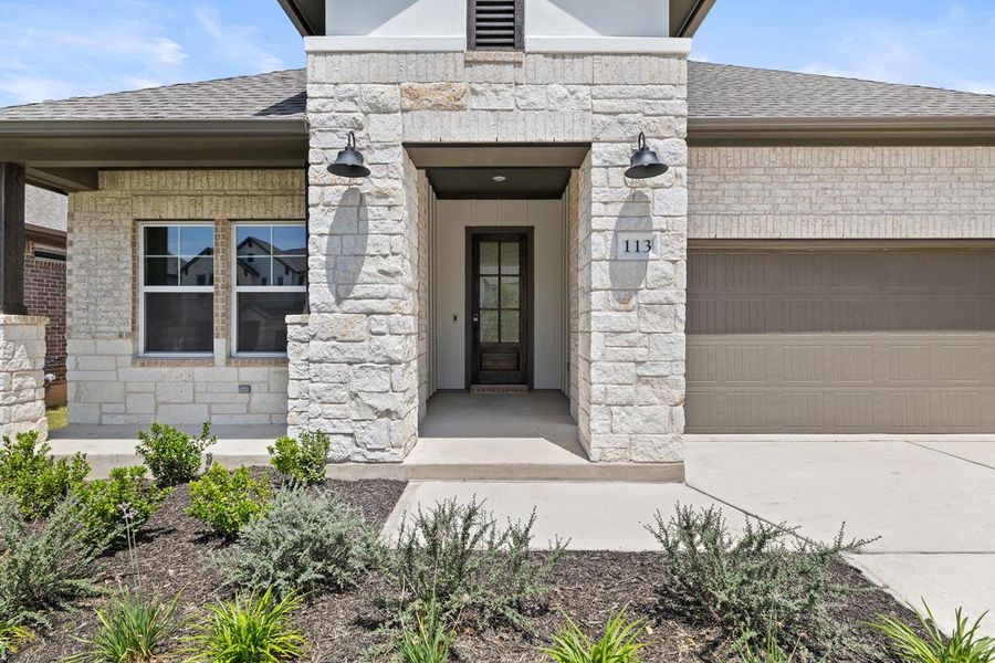 Front exterior of a new home in Park Collection at Lariat, Liberty Hill, TX, highlighting curb appeal (Image 24). Front exterior of a new home in Park Collection at Lariat, Liberty Hill, TX, highlighting curb appeal (Image 24).