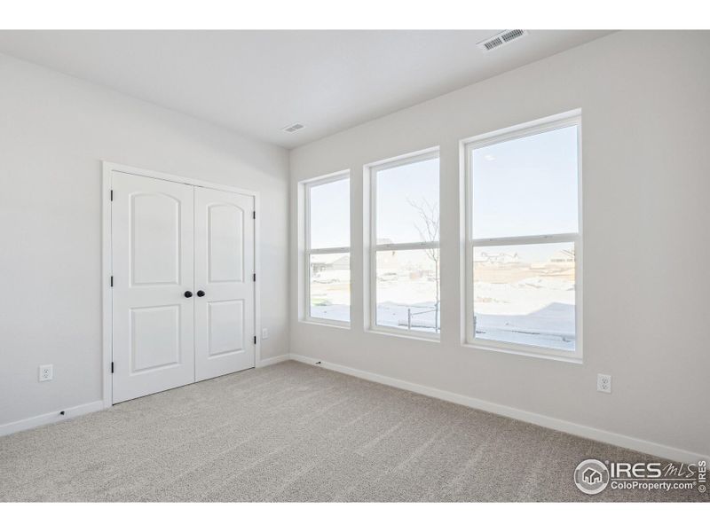 Spacious, unfurnished interior of a new home in Kinston Mainstreet Townhomes, Loveland (Image 19).