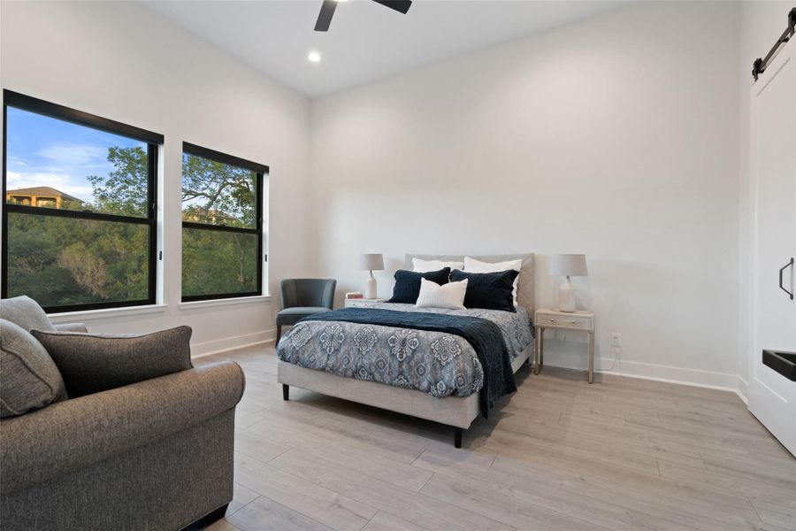 . Three additional ensuite bedrooms provide generous accommodations for family and guests alike.