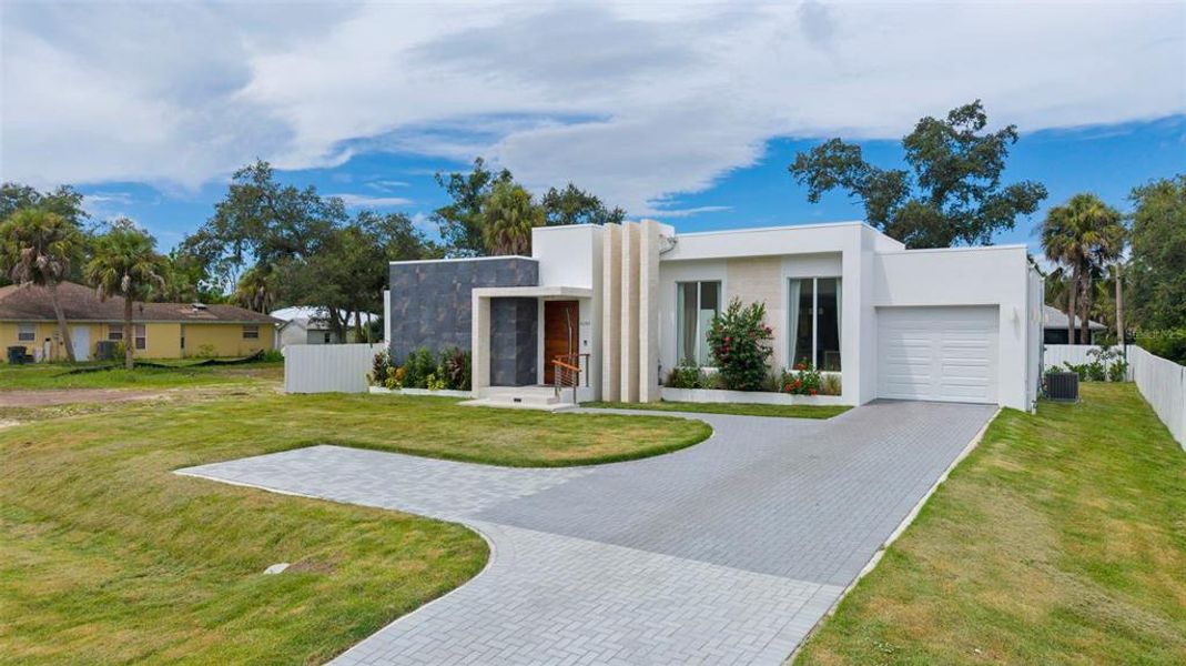 Front exterior of a new home in , North Port, FL, highlighting curb appeal (Image 24).