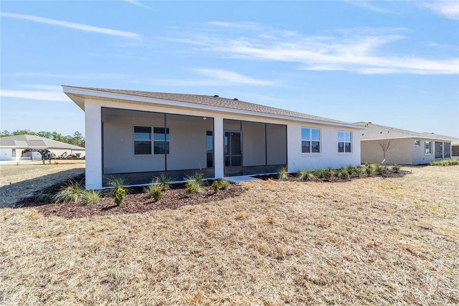 Exterior details and patio area of a home in On Top of the World Communities, Ocala (Image 3).