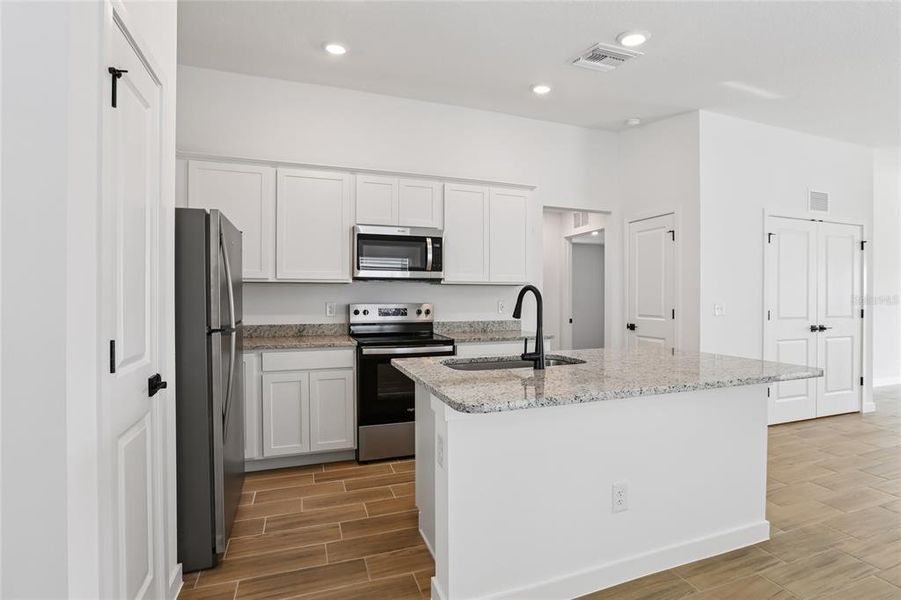 Furnished interior view inside a new home in Trilby Crossing, Brooksville (Image 3).
