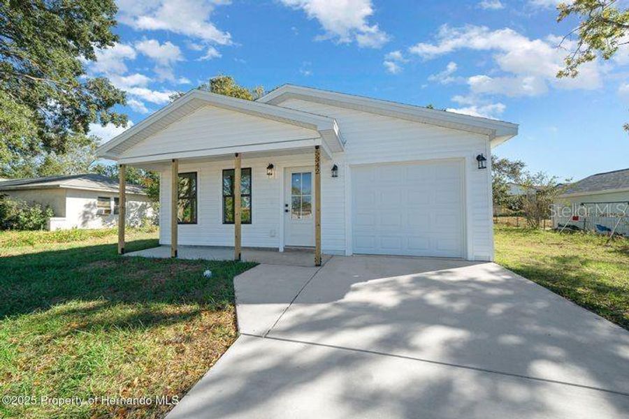 Front exterior of a new home in , Weeki Wachee, FL, highlighting curb appeal (Image 1). Front exterior of a new home in , Weeki Wachee, FL, highlighting curb appeal (Image 1).