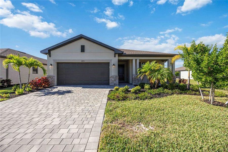 Front exterior of a new home in , Port Charlotte, FL, highlighting curb appeal (Image 23).
