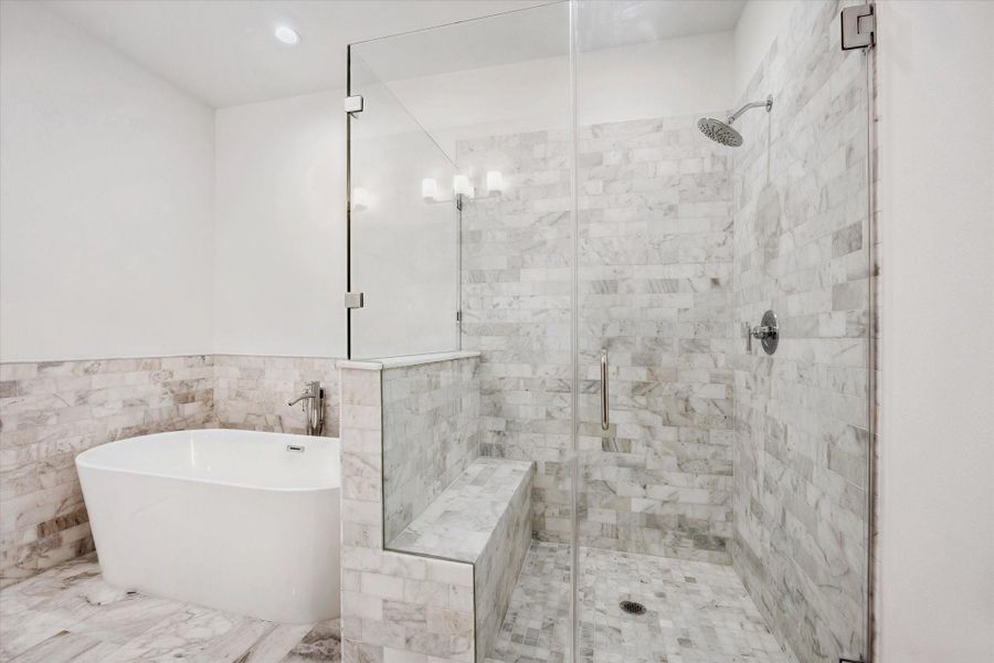 Separate Frameless Shower * Surrounded by Marble * Bench Seating. Separate Frameless Shower * Surrounded by Marble * Bench Seating.