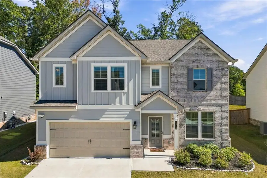 Front exterior of a new home in Dixon Farm, Fayetteville, GA, highlighting curb appeal (Image 1). Front exterior of a new home in Dixon Farm, Fayetteville, GA, highlighting curb appeal (Image 1).