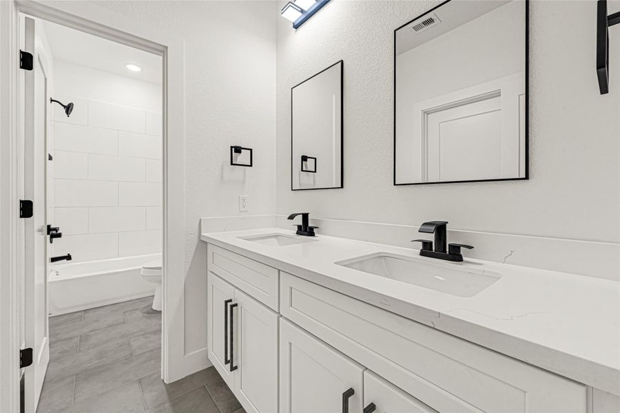 Jack and Jill bath shared by two secondary bedrooms on the second floor Jack and Jill bath shared by two secondary bedrooms on the second floor