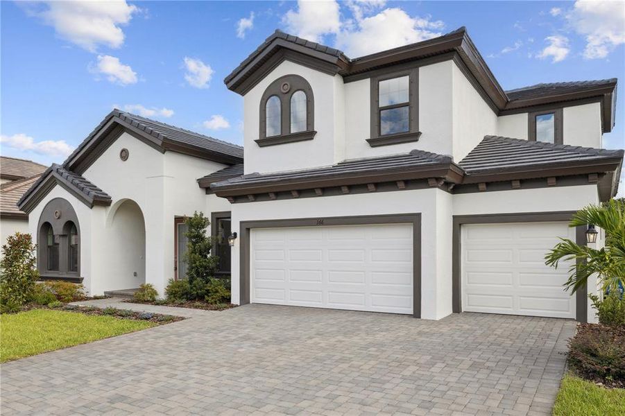Front exterior of a new home in Hidden Lakes, Brandon, FL, highlighting curb appeal (Image 2). Front exterior of a new home in Hidden Lakes, Brandon, FL, highlighting curb appeal (Image 2).