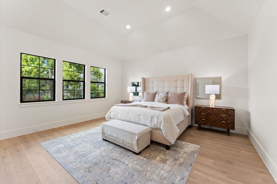 Discover a haven of comfort and leisure with a primary bedroom that includes 14 ft cathedral ceilings, plenty of natural light and a lavish bathroom. Discover a haven of comfort and leisure with a primary bedroom that includes 14 ft cathedral ceilings, plenty of natural light and a lavish bathroom.