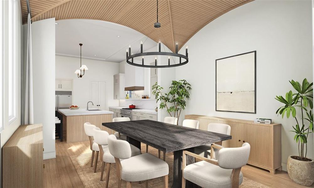 This dining space features a stunning wood-paneled ceiling, cozy textures, and a seamless flow into the kitchen. The ideal spot for gathering and creating memories.