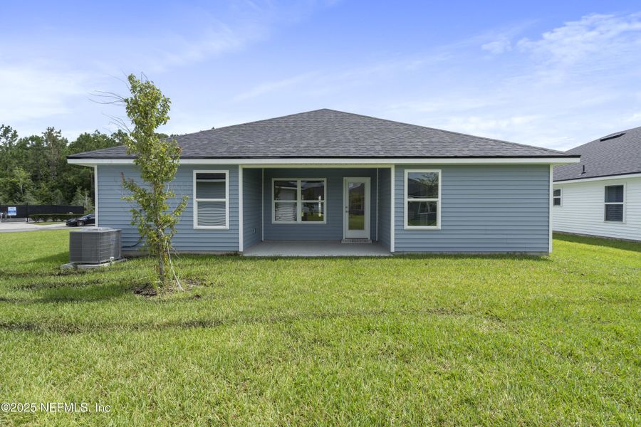 Front exterior of a new home in Summerglen, Jacksonville, FL, highlighting curb appeal (Image 2).