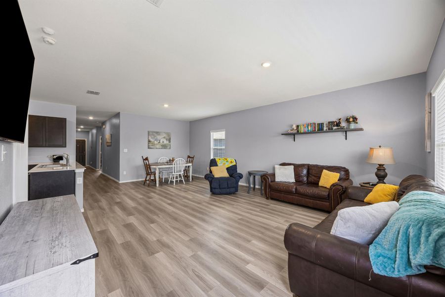 Living room with LVP floors and recessed lighting Living room with LVP floors and recessed lighting