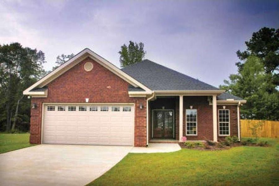 Front exterior of a new home in , Gonzales, TX, highlighting curb appeal (Image 1).
