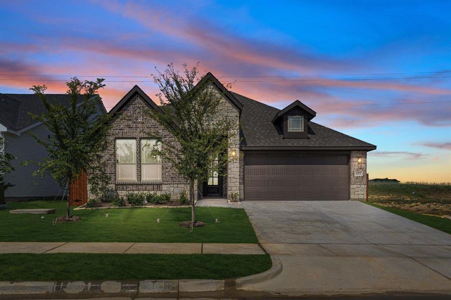Front exterior of a new home in Godley Ranch Classic, Godley, TX, highlighting curb appeal (Image 21). Front exterior of a new home in Godley Ranch Classic, Godley, TX, highlighting curb appeal (Image 21).