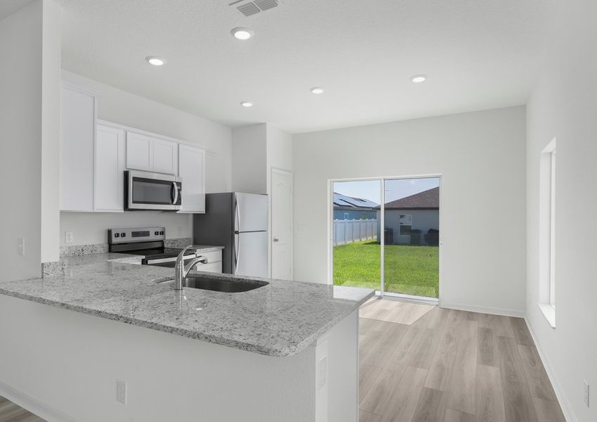 Large granite countertops make the chef-ready kitchen Large granite countertops make the chef-ready kitchen