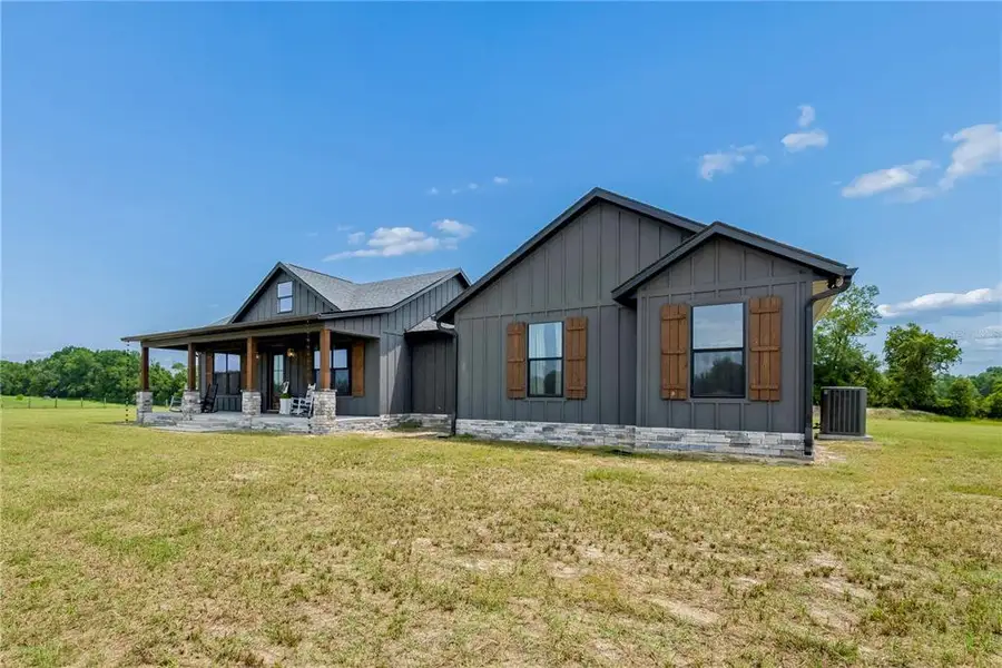 Front exterior of a new home in , Bell, FL, highlighting curb appeal (Image 2). Front exterior of a new home in , Bell, FL, highlighting curb appeal (Image 2).
