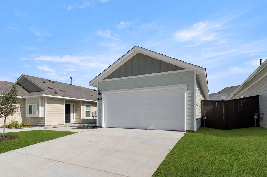 Front exterior of a new home in Cloverleaf, Austin, TX, highlighting curb appeal (Image 17).