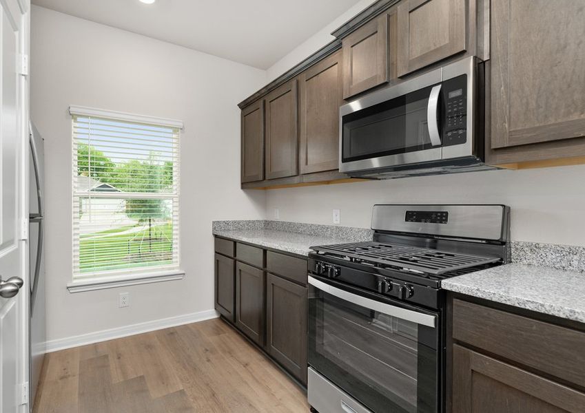 The kitchen of the Driftwood has beautiful wood cabinetry. The kitchen of the Driftwood has beautiful wood cabinetry.