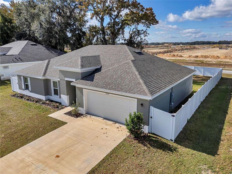 Front exterior of a new home in Diamond Ridge, Belleview, FL, highlighting curb appeal (Image 16).