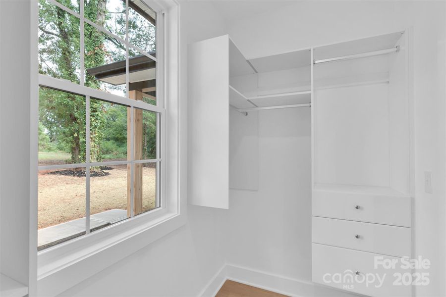 primary bedroom walk-in closet primary bedroom walk-in closet