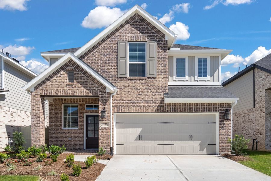 Front exterior of a new home in Evergreen, Conroe, TX, highlighting curb appeal (Image 21). Front exterior of a new home in Evergreen, Conroe, TX, highlighting curb appeal (Image 21).