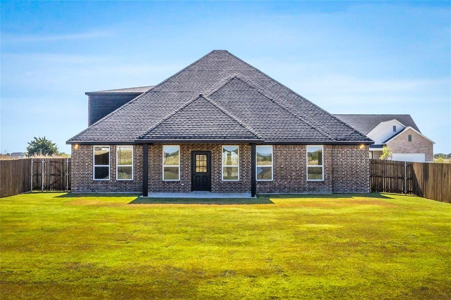 Front exterior of a new home in , Venus, TX, highlighting curb appeal (Image 1).