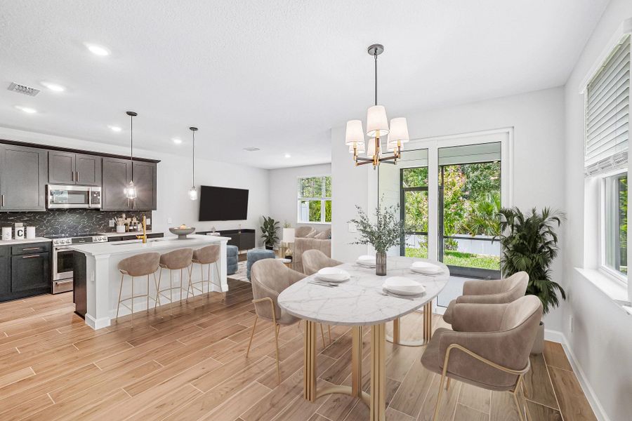 Virtually staged dining, kitchen and family room space