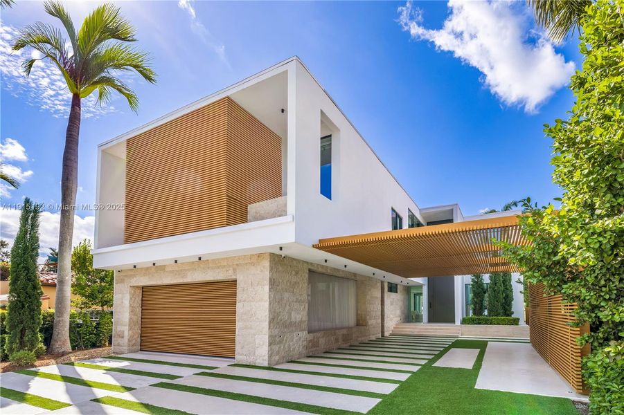 Front exterior of a new home in , Miami Beach, FL, highlighting curb appeal (Image 1). Front exterior of a new home in , Miami Beach, FL, highlighting curb appeal (Image 1).