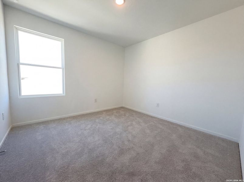 Spacious, unfurnished interior of a new home in Hunters Ranch, San Antonio (Image 12).