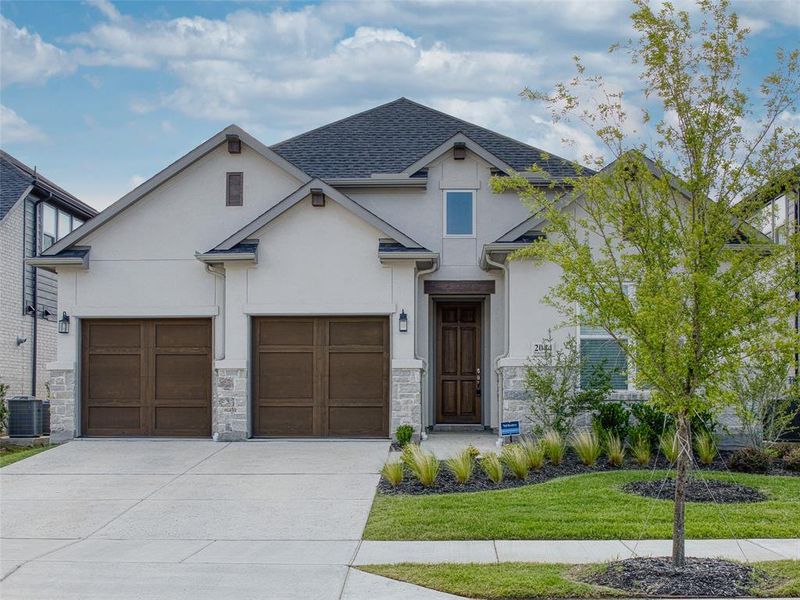 Front exterior of a new home in , Prosper, TX, highlighting curb appeal (Image 25). Front exterior of a new home in , Prosper, TX, highlighting curb appeal (Image 25).