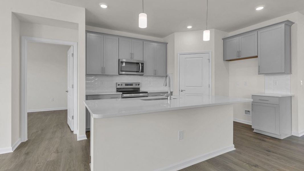 Representative furnished interior of a home built from the BRISTOL by D.R. Horton in The Villas at Galvins Ridge, Sanford (Image 7).