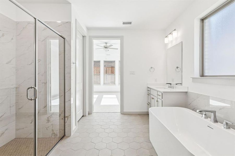 You'll enjoy a spa like experience every day in this spacious owner's bath featuring freestanding tub and walk in shower! You'll enjoy a spa like experience every day in this spacious owner's bath featuring freestanding tub and walk in shower!