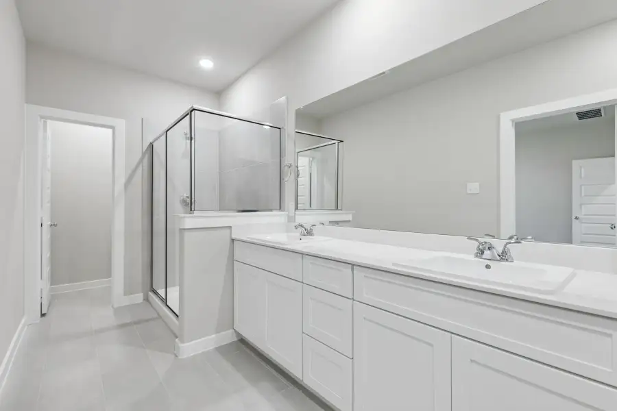 Primary Bathroom in the Holden home plan by Trophy Signature Homes – REPRESENTATIVE PHOTO