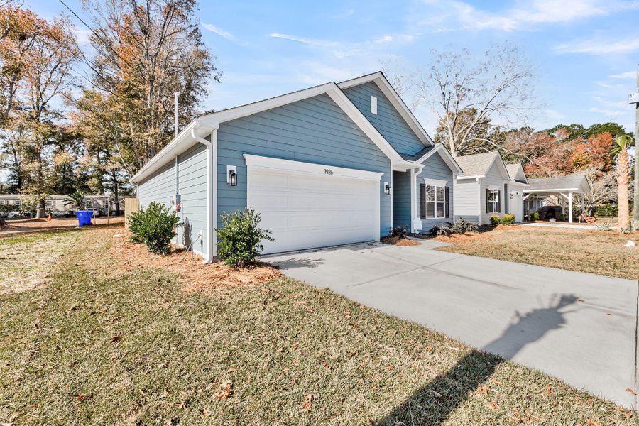 Front exterior of a new home in , Charleston, SC, highlighting curb appeal (Image 2).