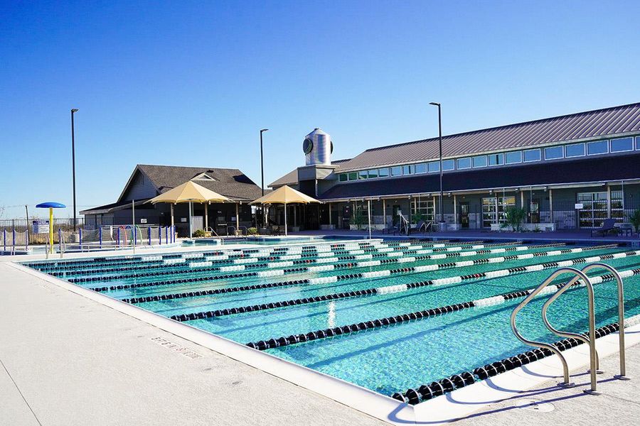 A well-maintained community pool awaits, featuring multiple lanes for recreation and fitness.