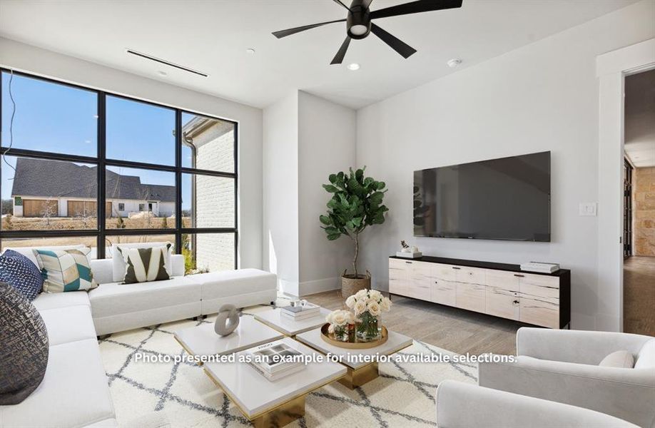 Living room featuring wood-type flooring and ceiling fan