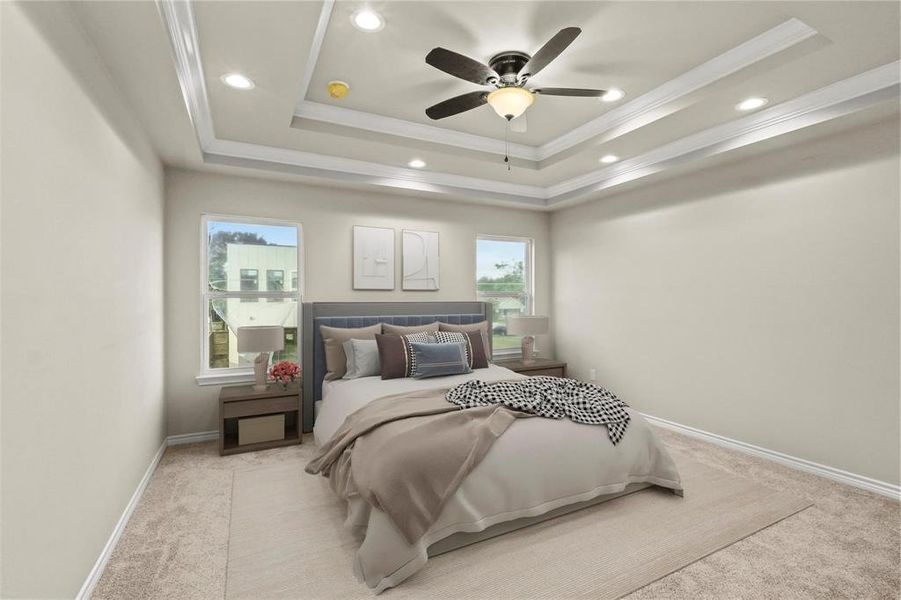 Bedroom with light carpet, a tray ceiling, multiple windows, and ceiling fan